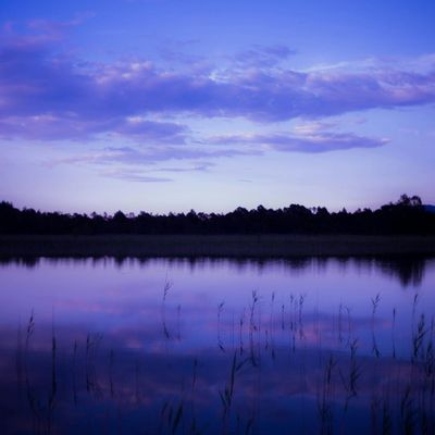 Symbolic image of a calm water surface reflecting the sky.